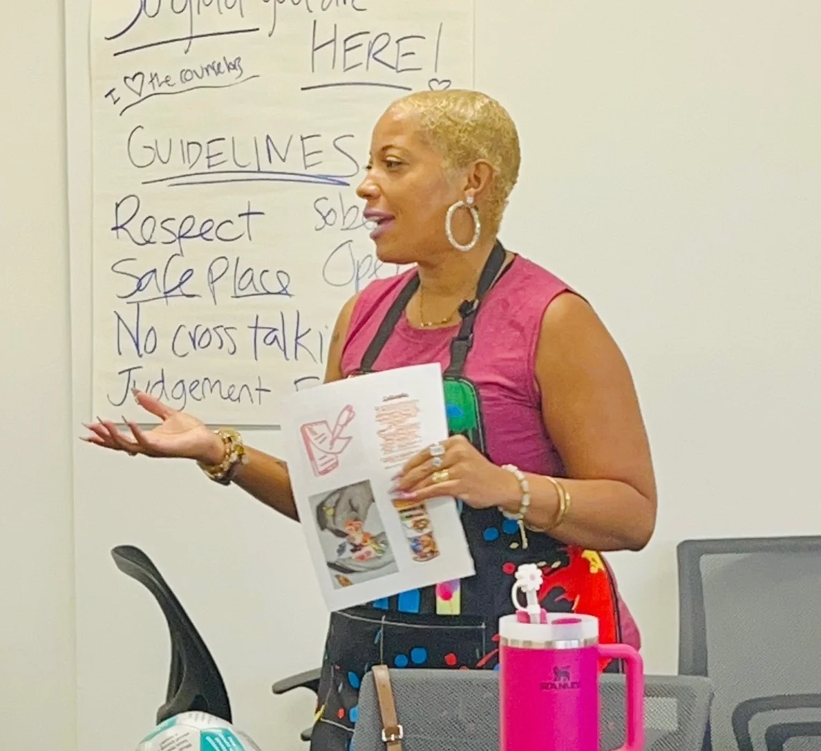 Jay Boyer leading a group class beside a whiteboard